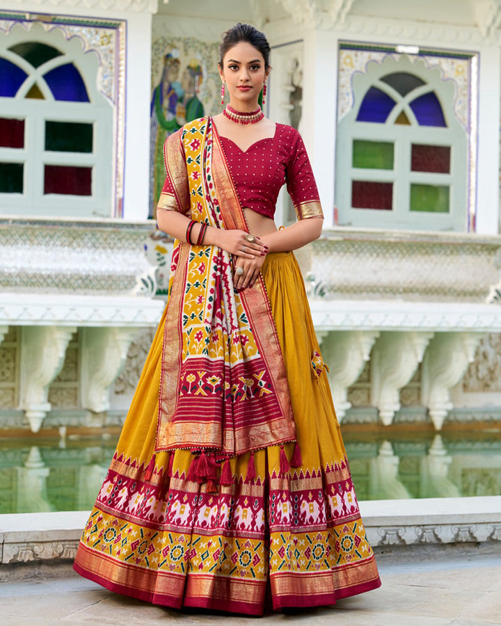 Patola Printed Mustard Color Tussar Silk Lehenga Choli