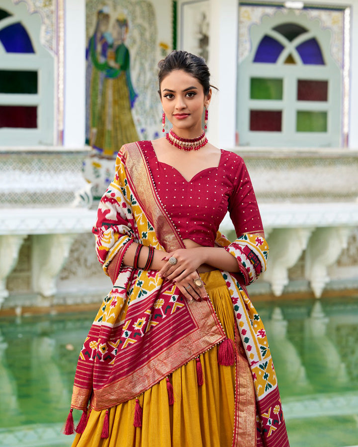 Patola Printed Mustard Color Tussar Silk Lehenga Choli