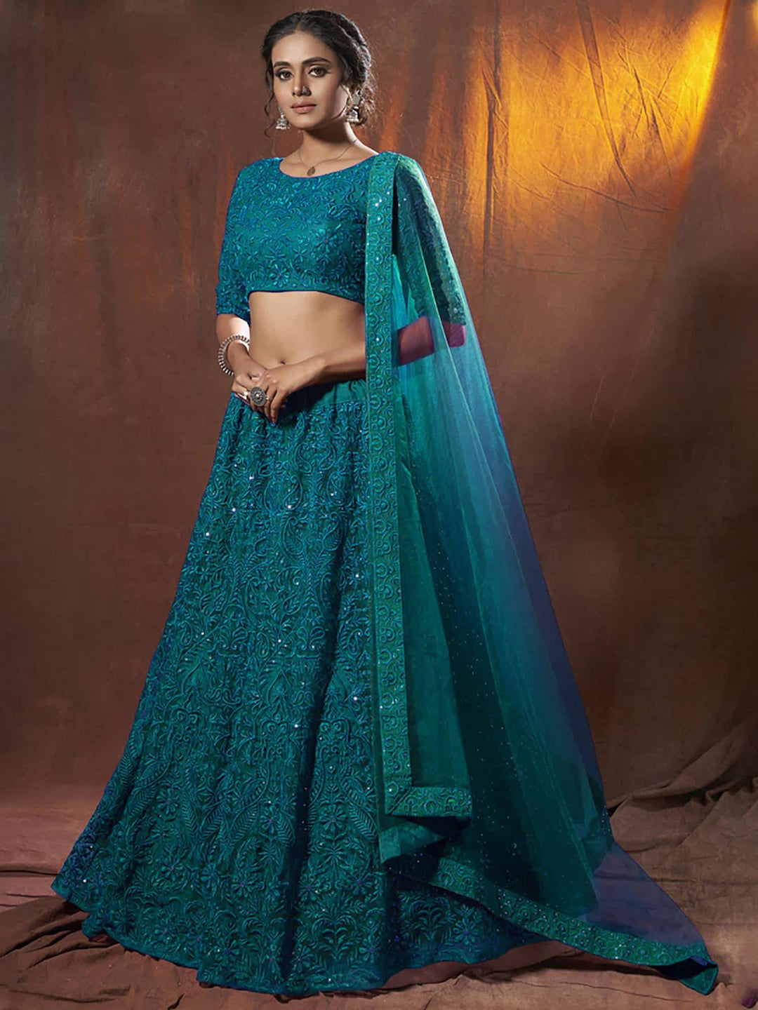 Rama Thread Embroidered Net Wedding Wear Lehenga Choli